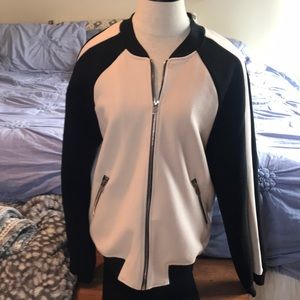 Light-weight jacket, zip -up ,color: black, cream, black, gray, strip down arm.